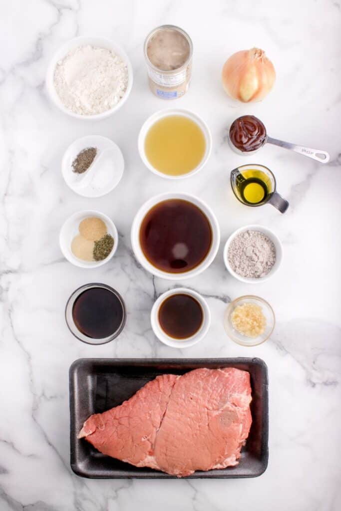 Ingredients for round steak: top round steak, Italian seasoning, onion powder, garlic powder, salt, black pepper, flour, vegetable oil, onion, garlic, cream of mushroom soup, beef broth, Worcestershire sauce, brown gravy mix, pineapple juice, soy sauce, and BBQ sauce.