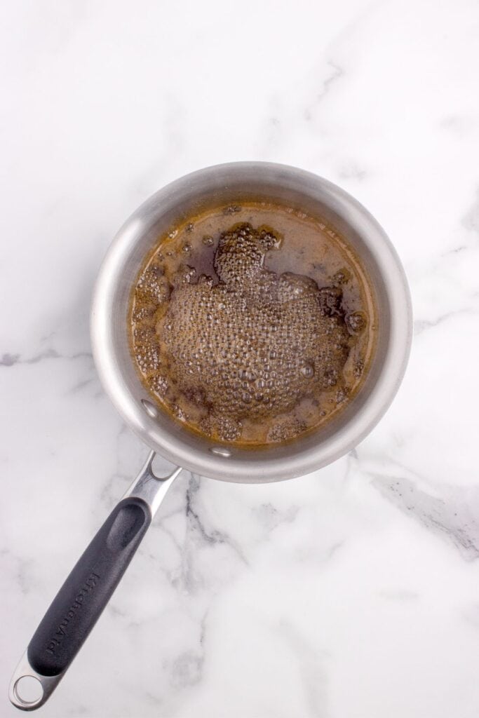 A glaze for the spiral ham is in a saucepan.