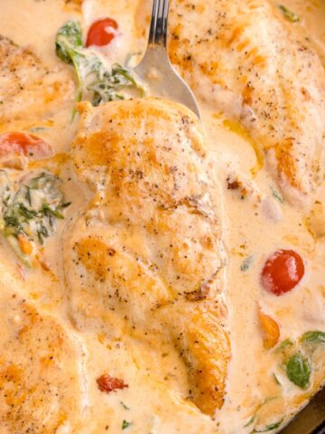 Cooked Tuscan chicken in a skillet.