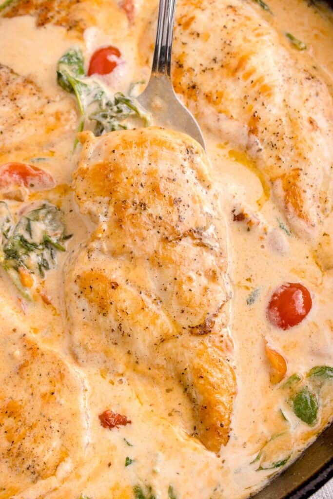 Cooked Tuscan chicken in a skillet.