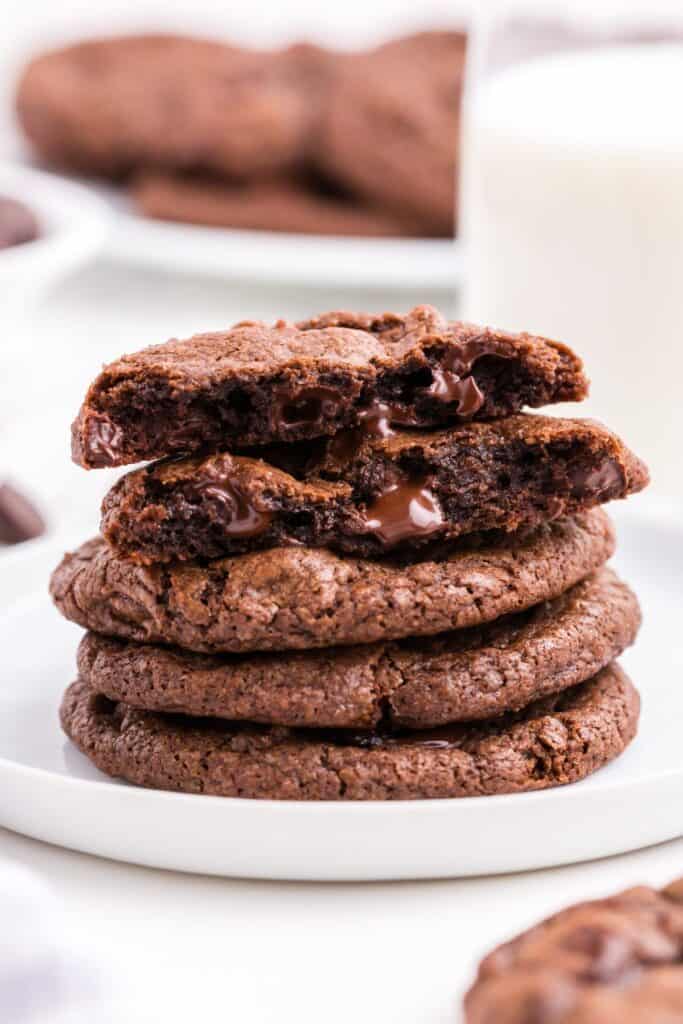 Stack of cookies on a white plate.