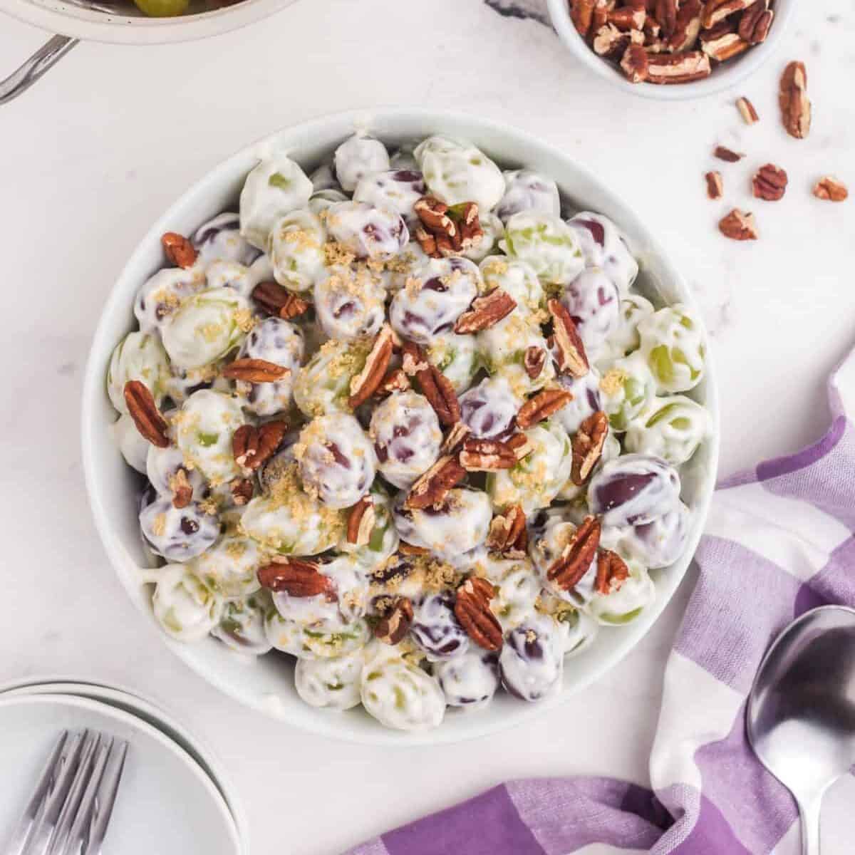 creamy grape salad topped with pecan pieces