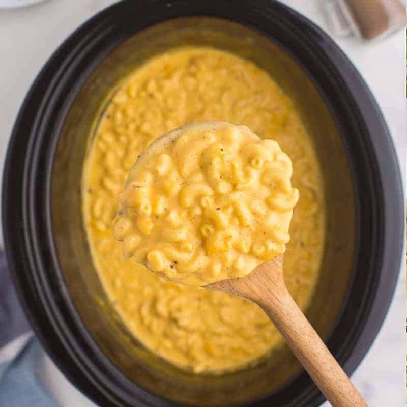 Velveeta mac and cheese scooped up on a woodn spoon.