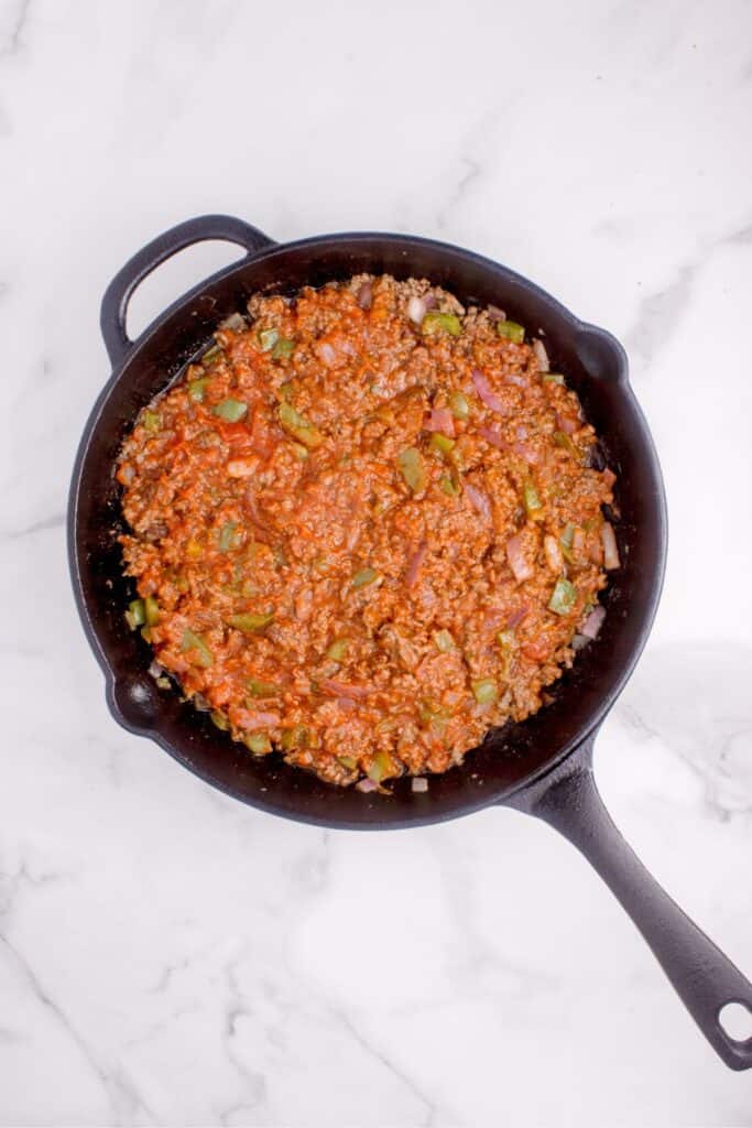 Prepared filling in a cast iron pan.