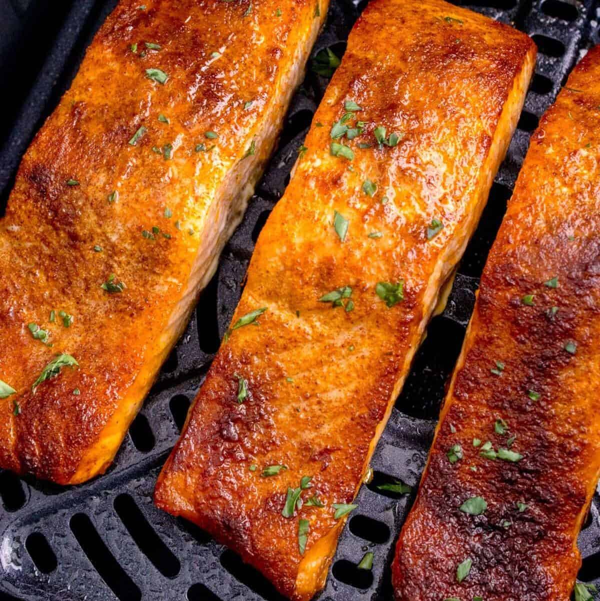 Closeup of cooked salmon in the air fryer.