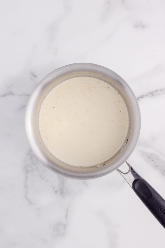 White gravy in a sauce pan.