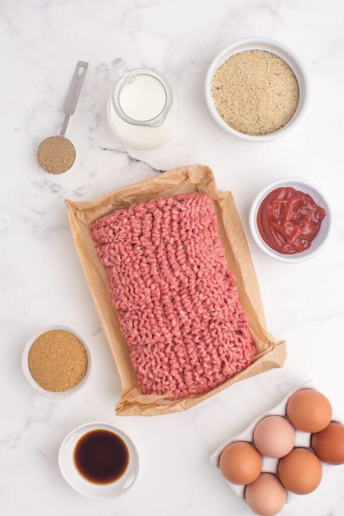 Ingredients for meatloaf: ground beef, meatloaf seasoning, eggs, seasoned breadcrumbs, milk, Worcestershire sauce, ketchup, brown sugar