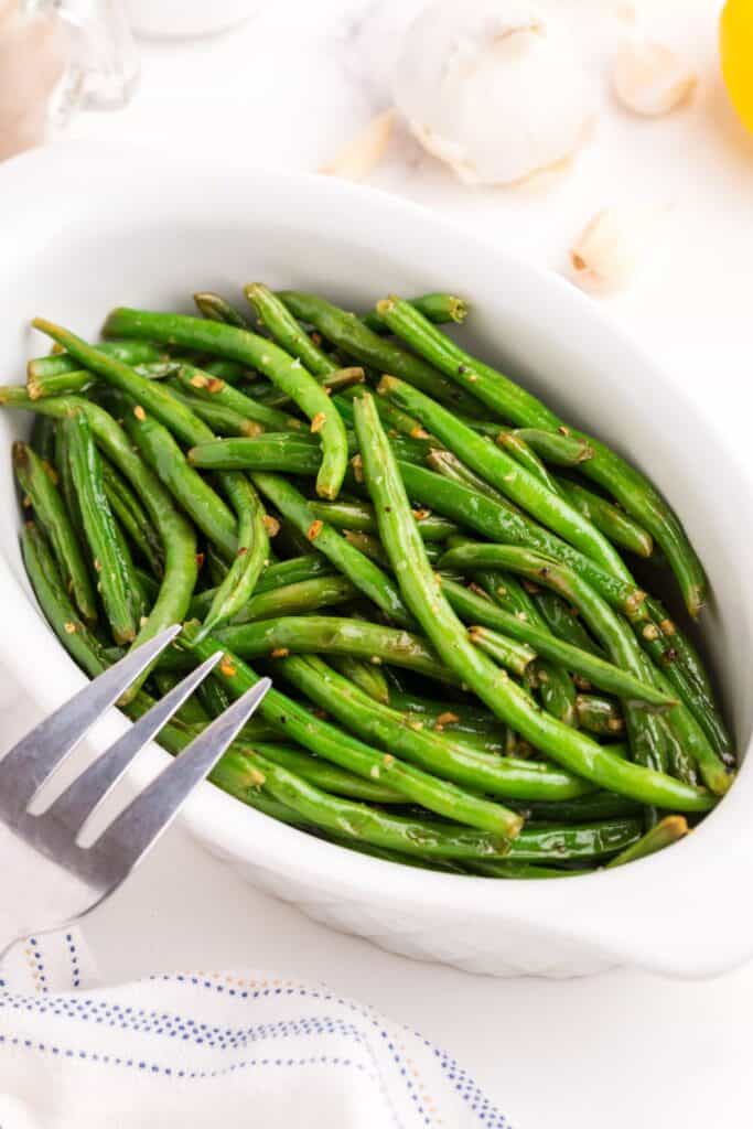 Serving dish with green beans.