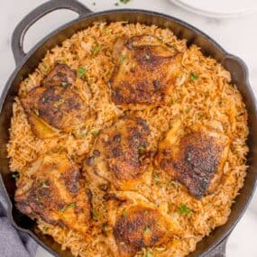 Chicken and rice in cast iron pan.