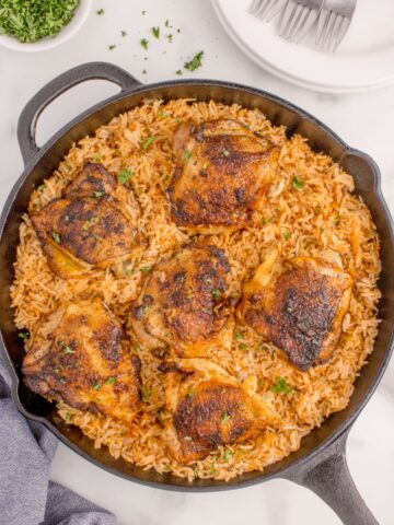 Chicken and rice in cast iron pan.